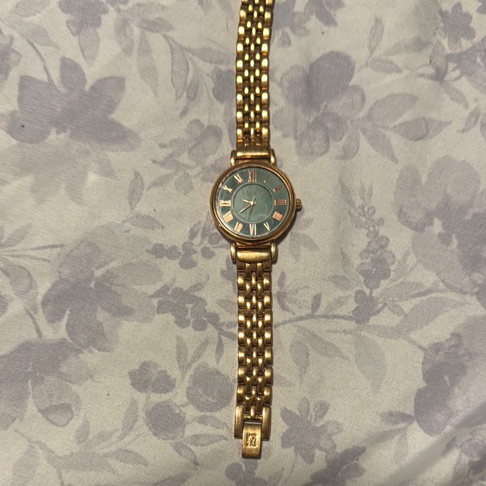 Gold and Blue Watch with Roman Numerals
